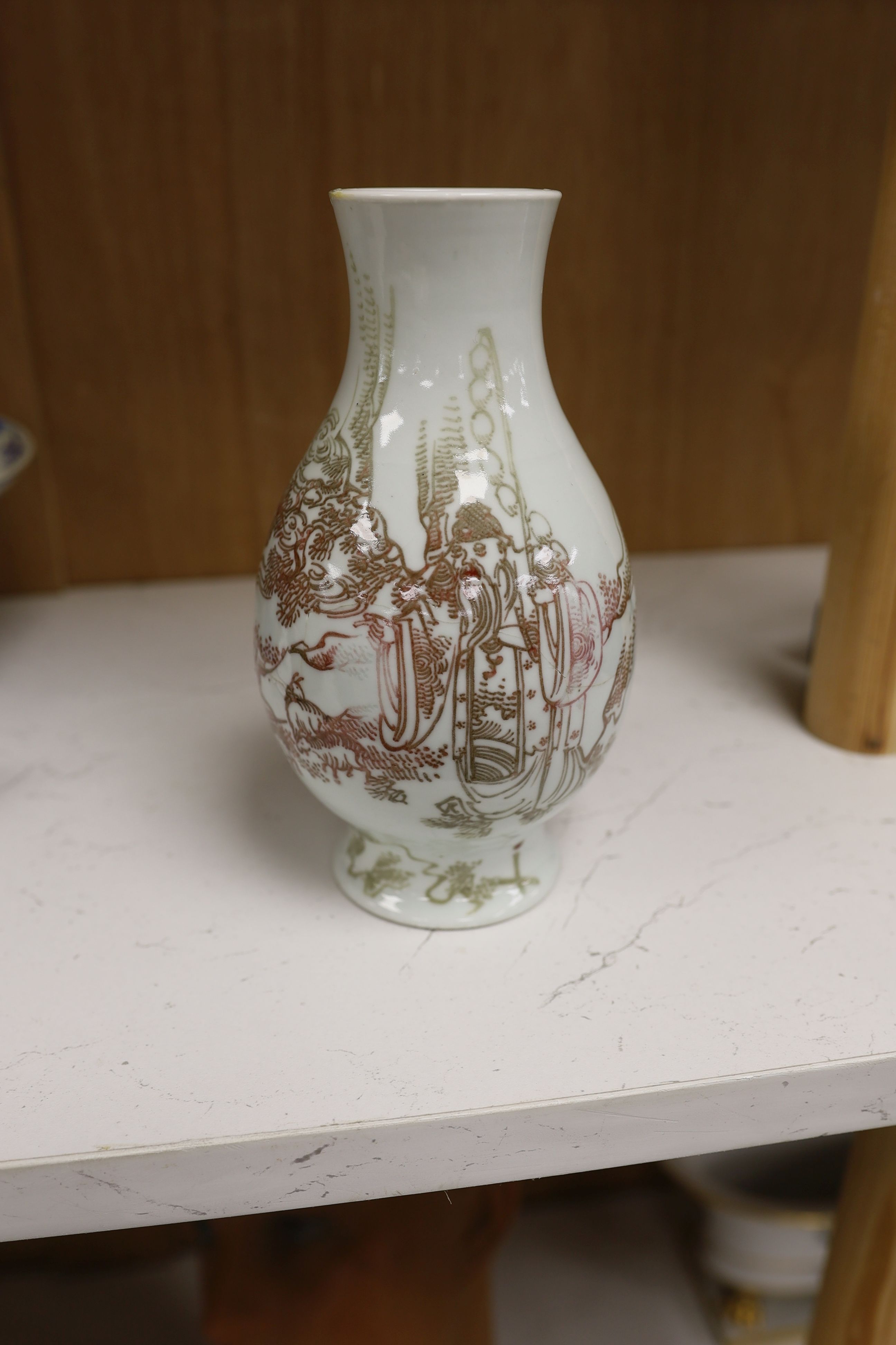 A Chinese underglaze copper red ‘herder and goats’ vase, Kangxi six character mark but Republic period and a Chinese blue and white lotus stem dish, six character Guangxu mark and period, both damaged